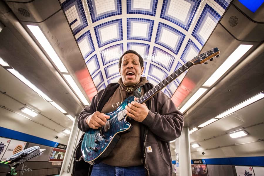 Musicians playing inside a subway station